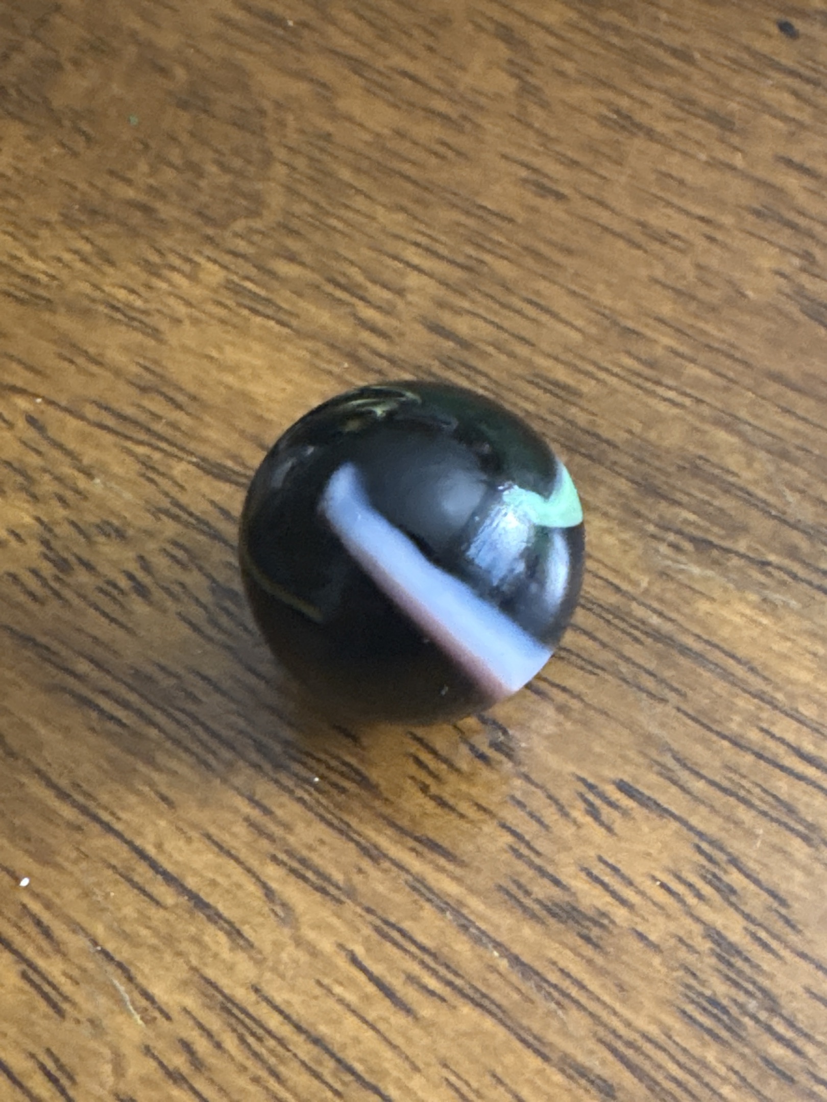 Black Conqueror with Green and Lavender-White ribbons by Vitro Agate Company